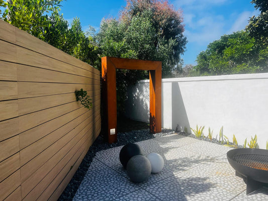 Garden installation with corten frame and stone balls