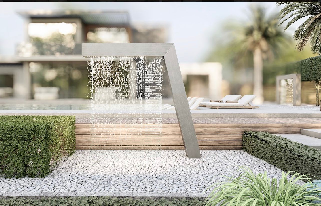  Modern waterfall spout in landscaped garden