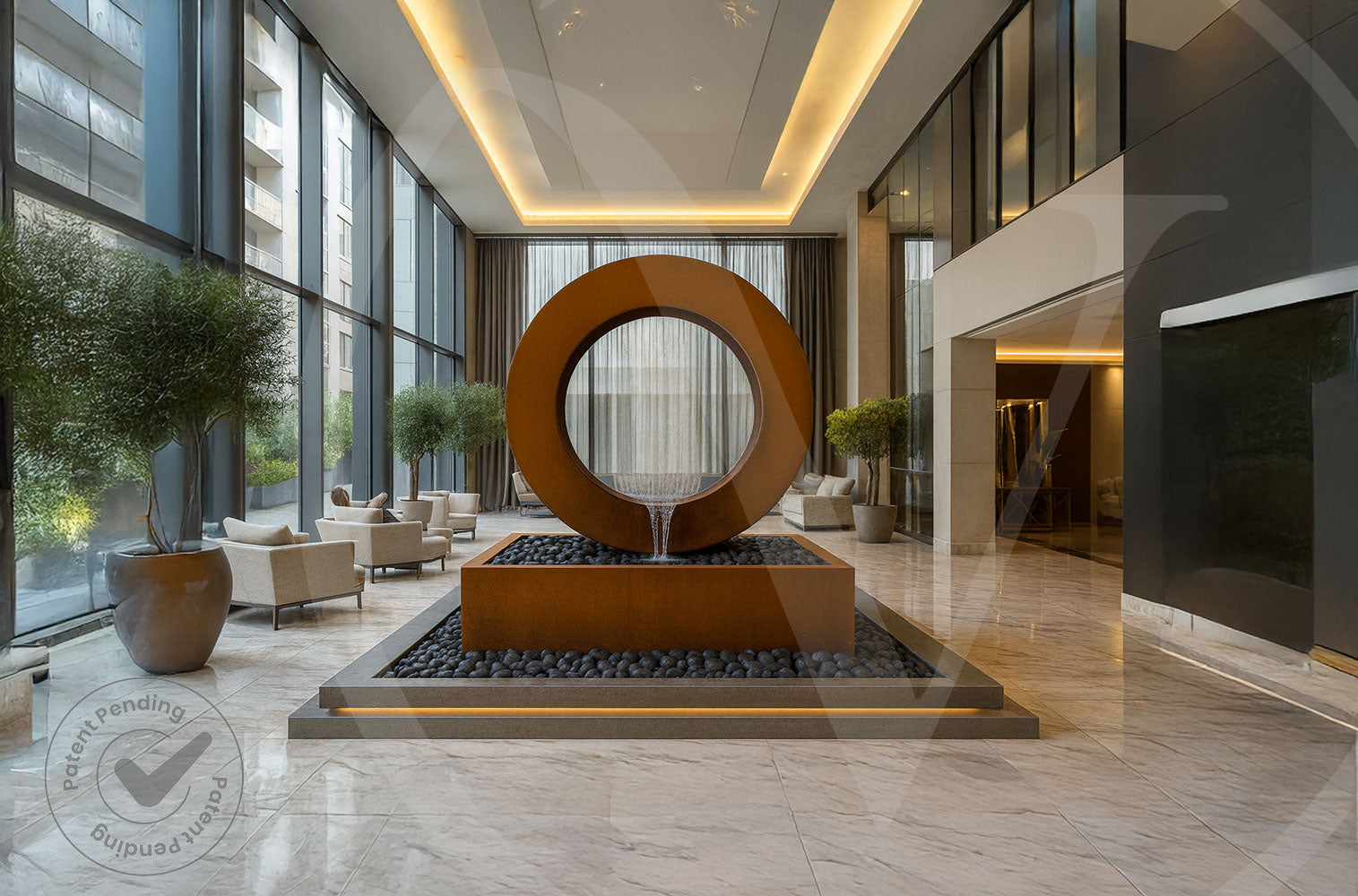 Large corten steel ring fountain with a rectangular pebble-filled basin serving as a dramatic focal point in a modern luxury hotel lobby.